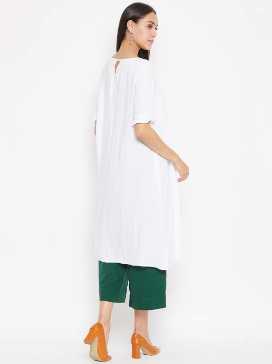 A peek-a-boo detailing on the back neck of the white a line kurta