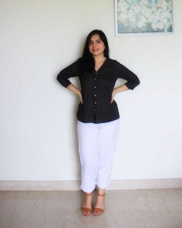 Black cotton top with V neckline and white button detail