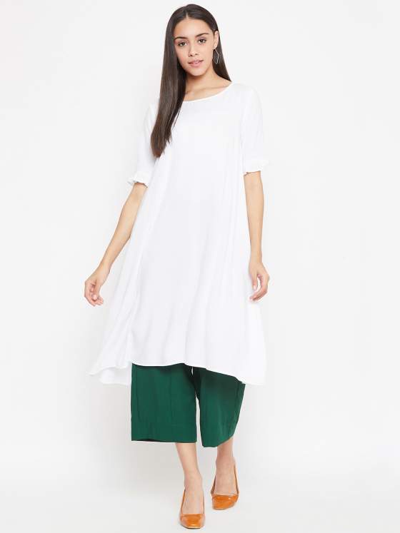 A white aline kurta with a soft boat neck and light frills along the hem of the sleeve