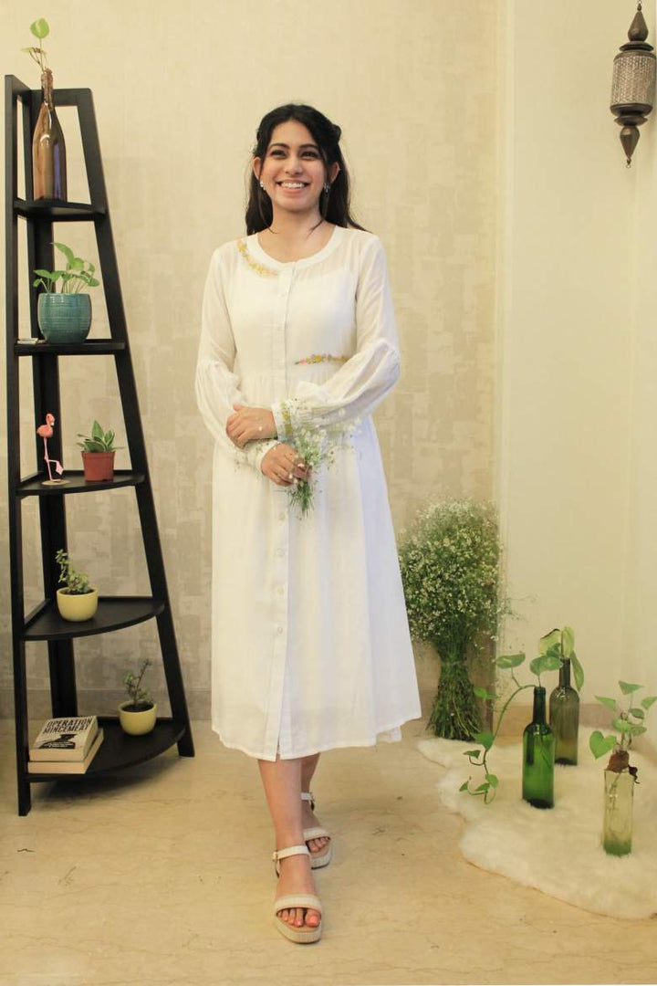 A floral embroidered white cotton silk dress